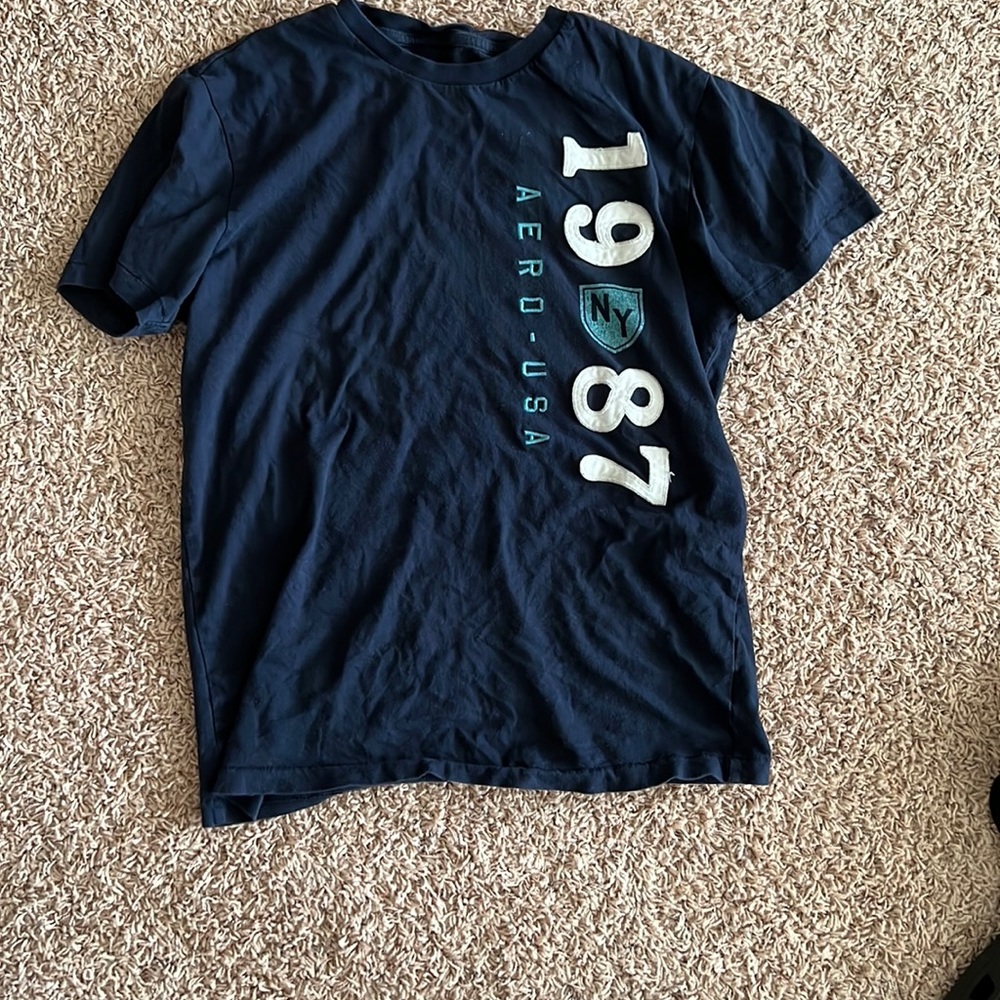 Used blue short sleeve Aero shirt. Size small.
